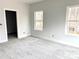 Comfortable bedroom featuring soft carpeting, a neutral color palette, and natural light, ideal for relaxation and rest at 2418 Lexington Approach Dr, Charlotte, NC 28262