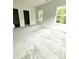 Large bedroom featuring plush carpet, natural light, and easy access to adjacent rooms at 2418 Lexington Approach Dr, Charlotte, NC 28262