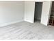 Inviting bedroom showcasing soft carpeting, neutral tones, and ample closet space for a comfortable and organized living area at 2418 Lexington Approach Dr, Charlotte, NC 28262