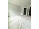 Expansive bedroom with plush carpet, featuring natural light and easy access to other rooms at 2418 Lexington Approach Dr, Charlotte, NC 28262
