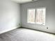 Bedroom with carpet flooring and a window overlooking the outdoors at 2418 Lexington Approach Dr, Charlotte, NC 28262