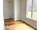Bright bedroom with hardwood floors and large windows offering natural light at 2418 Lexington Approach Dr, Charlotte, NC 28262