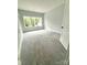 Bright bedroom with plush carpet and a large window showcasing a lush outdoor view at 2418 Lexington Approach Dr, Charlotte, NC 28262