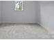 Bedroom featuring neutral carpet, a large window, and fresh paint at 2418 Lexington Approach Dr, Charlotte, NC 28262