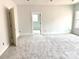 Serene bedroom featuring plush carpeting, a neutral color scheme, and natural light, creating a peaceful and inviting space at 2418 Lexington Approach Dr, Charlotte, NC 28262