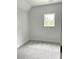 Cozy bedroom with plush carpet and a single window offering natural light at 2418 Lexington Approach Dr, Charlotte, NC 28262