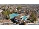 Aerial view of the community amenities including tennis courts and a pool at 2418 Lexington Approach Dr, Charlotte, NC 28262