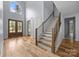 Open entryway with staircase, hardwood floors, and a wooden front door at 2418 Lexington Approach Dr, Charlotte, NC 28262