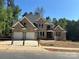 Stunning two-story brick home with a two-car garage and a beautifully designed front exterior at 2418 Lexington Approach Dr, Charlotte, NC 28262