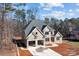 Aesthetic aerial view of a brick home with an attached two-car garage at 2418 Lexington Approach Dr, Charlotte, NC 28262