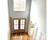 Bright foyer with double entry doors, hardwood floors, and a large window bringing in natural light at 2418 Lexington Approach Dr, Charlotte, NC 28262