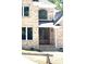 Close-up of the brick home's front door with glass panels and a stone walkway leading up to it at 2418 Lexington Approach Dr, Charlotte, NC 28262