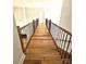 Hallway featuring hardwood floors and a view of stairs and a doorway at 2418 Lexington Approach Dr, Charlotte, NC 28262
