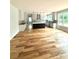A expansive kitchen with a contrasting island, modern appliances, and stunning hardwood flooring at 2418 Lexington Approach Dr, Charlotte, NC 28262