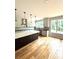 Stylish kitchen with an island, pendant lighting, and white cabinetry at 2418 Lexington Approach Dr, Charlotte, NC 28262
