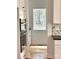 Modern gourmet kitchen with stainless double ovens, marble backsplash and a view out the window at 2418 Lexington Approach Dr, Charlotte, NC 28262