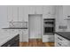 Kitchen featuring stainless steel appliances, shaker cabinets, and hardwood floors at 2418 Lexington Approach Dr, Charlotte, NC 28262