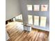 Spacious living room featuring hardwood floors, large windows, and modern finishes, perfect for a contemporary home design at 2418 Lexington Approach Dr, Charlotte, NC 28262