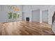 Bright living room with hardwood floors, fireplace, large windows, and an open concept design at 2418 Lexington Approach Dr, Charlotte, NC 28262