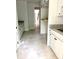 Mudroom area with white cabinets and a granite countertop at 2418 Lexington Approach Dr, Charlotte, NC 28262