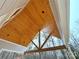 View of the exposed beams and wood paneled ceiling on the outdoor patio at 2418 Lexington Approach Dr, Charlotte, NC 28262