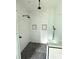 Sleek, tiled shower with built-in shelves, and modern fixtures at 2418 Lexington Approach Dr, Charlotte, NC 28262
