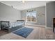 Comfortable bedroom with carpet, window and playful dinosaur decor at 2553 Cozy Cove Dr, York, SC 29745