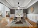 Dining room featuring a tray ceiling, hardwood floors, and wainscoting at 2553 Cozy Cove Dr, York, SC 29745