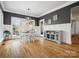 Bright dining room with hardwood floors, decorative trim, large window, and stylish furniture at 2553 Cozy Cove Dr, York, SC 29745