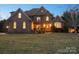 Charming brick two-story home with a beautifully landscaped front yard and inviting front porch at 2553 Cozy Cove Dr, York, SC 29745