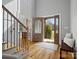 Inviting foyer featuring hardwood floors, staircase and a decorative front door at 2553 Cozy Cove Dr, York, SC 29745