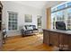 Sunny office featuring hardwood floors, a sofa and two large windows at 2553 Cozy Cove Dr, York, SC 29745