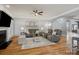 Cozy living room features hardwood floors, neutral furniture and a fireplace at 2553 Cozy Cove Dr, York, SC 29745