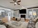 Open-concept living room with hardwood floors, fireplace, and plenty of natural light at 2553 Cozy Cove Dr, York, SC 29745