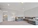 Cozy living room featuring plush seating, neutral carpet, and a peaceful ambiance at 2553 Cozy Cove Dr, York, SC 29745