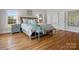 Well-appointed main bedroom with hardwood floors, stylish furnishings and ensuite bathroom access at 2553 Cozy Cove Dr, York, SC 29745