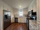 Bright kitchen featuring white cabinets, stainless steel appliances, and light countertops at 281 Fair Acres Ln, Taylorsville, NC 28681