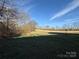 Backyard features an expansive grassy area, offering plenty of space at 32269 Pennington Rd, Albemarle, NC 28001