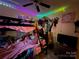 Whimsical bedroom featuring a bunk bed, ceiling fan, and colorful decorative lights at 32269 Pennington Rd, Albemarle, NC 28001