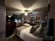 Comfortable bedroom with a ceiling fan, dresser, and ample storage at 32269 Pennington Rd, Albemarle, NC 28001