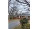 Charming single-story brick home featuring a driveway and well-kept front yard at 32269 Pennington Rd, Albemarle, NC 28001