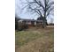 Charming single-story brick home with well-maintained lawn and mature trees at 32269 Pennington Rd, Albemarle, NC 28001
