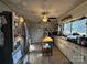 Functional kitchen featuring an island, stainless steel refrigerator, and ample counter space for meal preparation at 32269 Pennington Rd, Albemarle, NC 28001