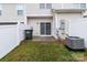Backyard with a patio, grass, and a white fence at 3553 Calpella Ct, Charlotte, NC 28262