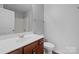 Bathroom boasts a large sink and a white shower-tub combo at 3553 Calpella Ct, Charlotte, NC 28262