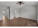 Large bedroom with a ceiling fan, and multiple doorways to other rooms at 3553 Calpella Ct, Charlotte, NC 28262