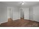 Bedroom with hardwood floors, ceiling fan and ensuite bathroom at 3553 Calpella Ct, Charlotte, NC 28262