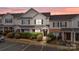 Charming townhouse with brick accents, landscaped front yard, black shutters and inviting front door at 3553 Calpella Ct, Charlotte, NC 28262