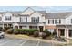 Charming townhouse with brick accents, landscaped front yard, black shutters and inviting front door at 3553 Calpella Ct, Charlotte, NC 28262