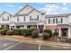 Charming townhouse featuring neutral siding, black shutters, well-maintained landscaping, and a welcoming entrance at 3553 Calpella Ct, Charlotte, NC 28262